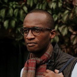 Mugshot of a man wearing glasses